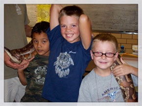 3 boys with a snake